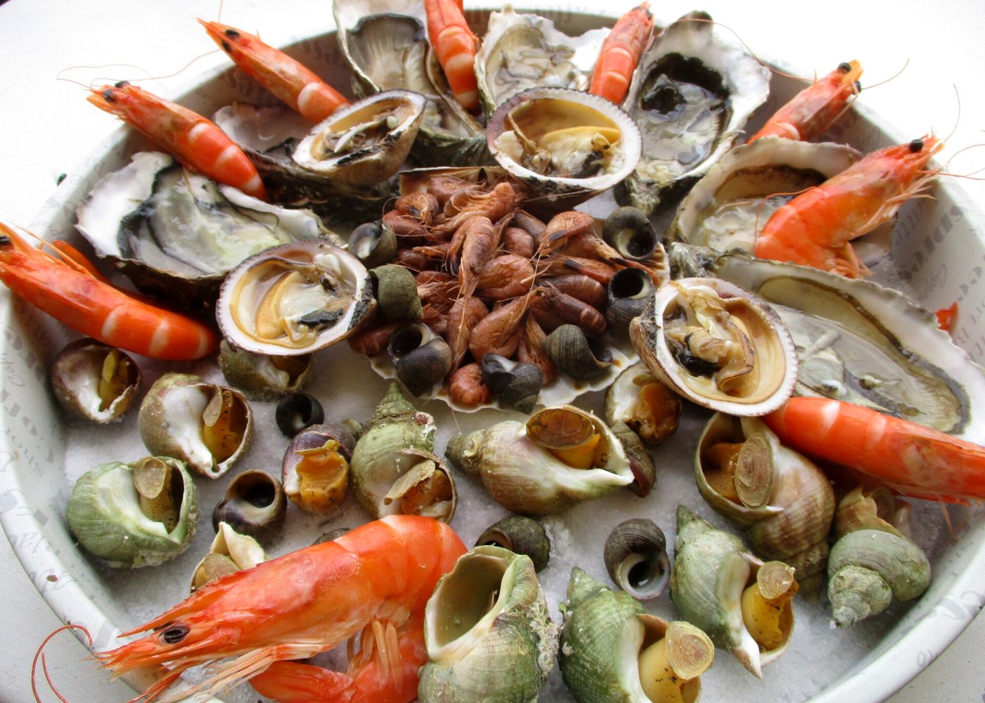 A shared seafood platter of shellfish, prawns and crab